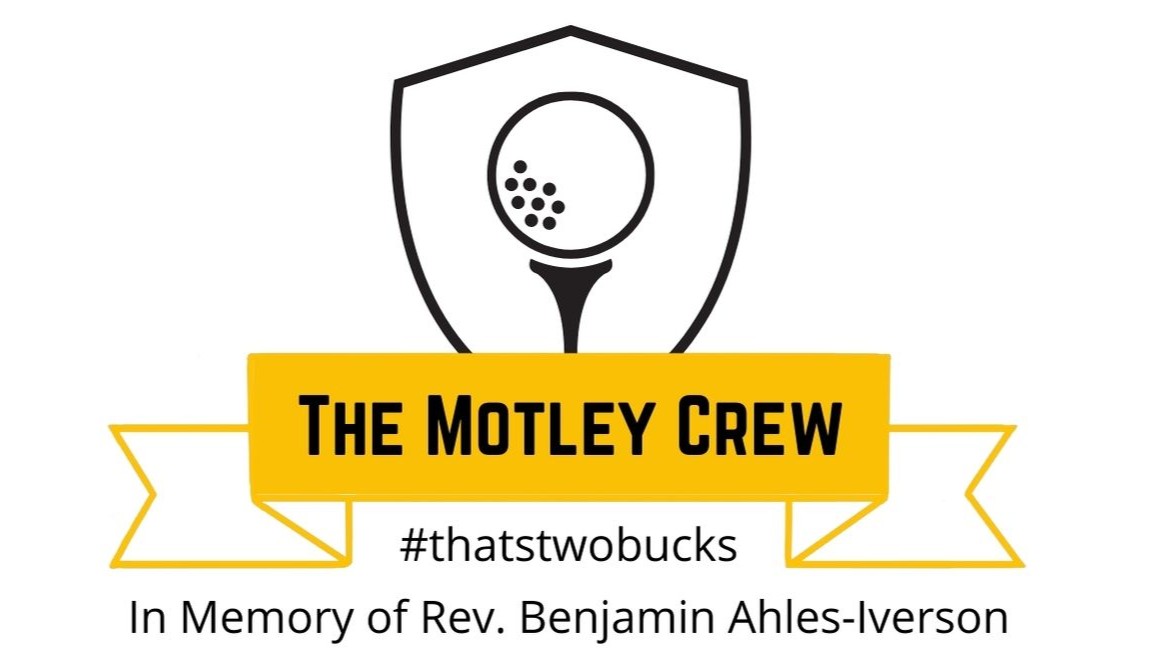 Memorial logo for The Motley Crew: shield with a golf ball on a tee, a yellow ribbon banner reading 'The Motley Crew' and tweet-style hashtag, honoring Rev. Benjamin Ahles-Iverson.